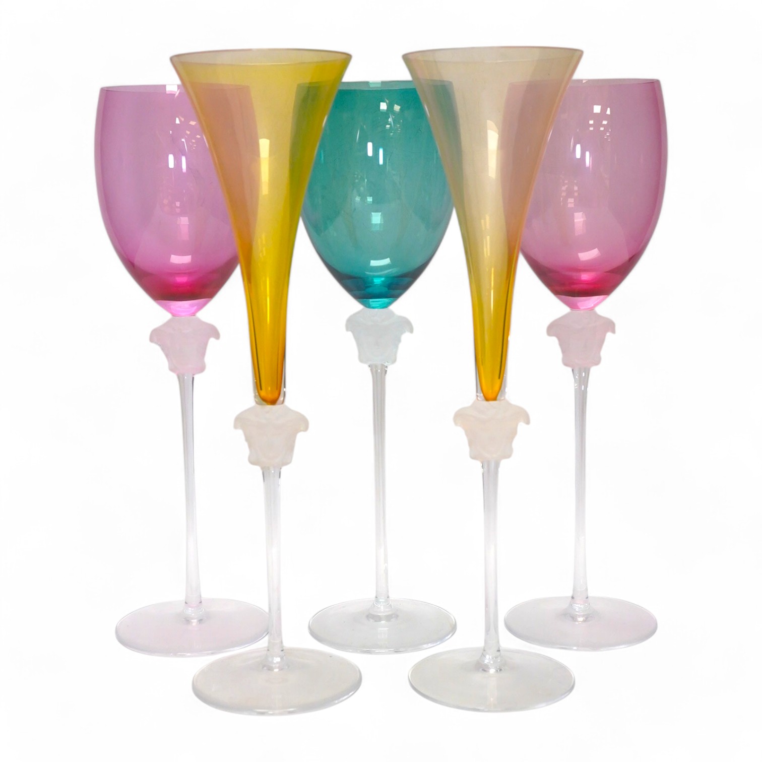 Five boxed Rosenthal for Versace Medusa head glasses; three wine glasses and two champagne flutes in various colours, 30cm high. Condition - good.